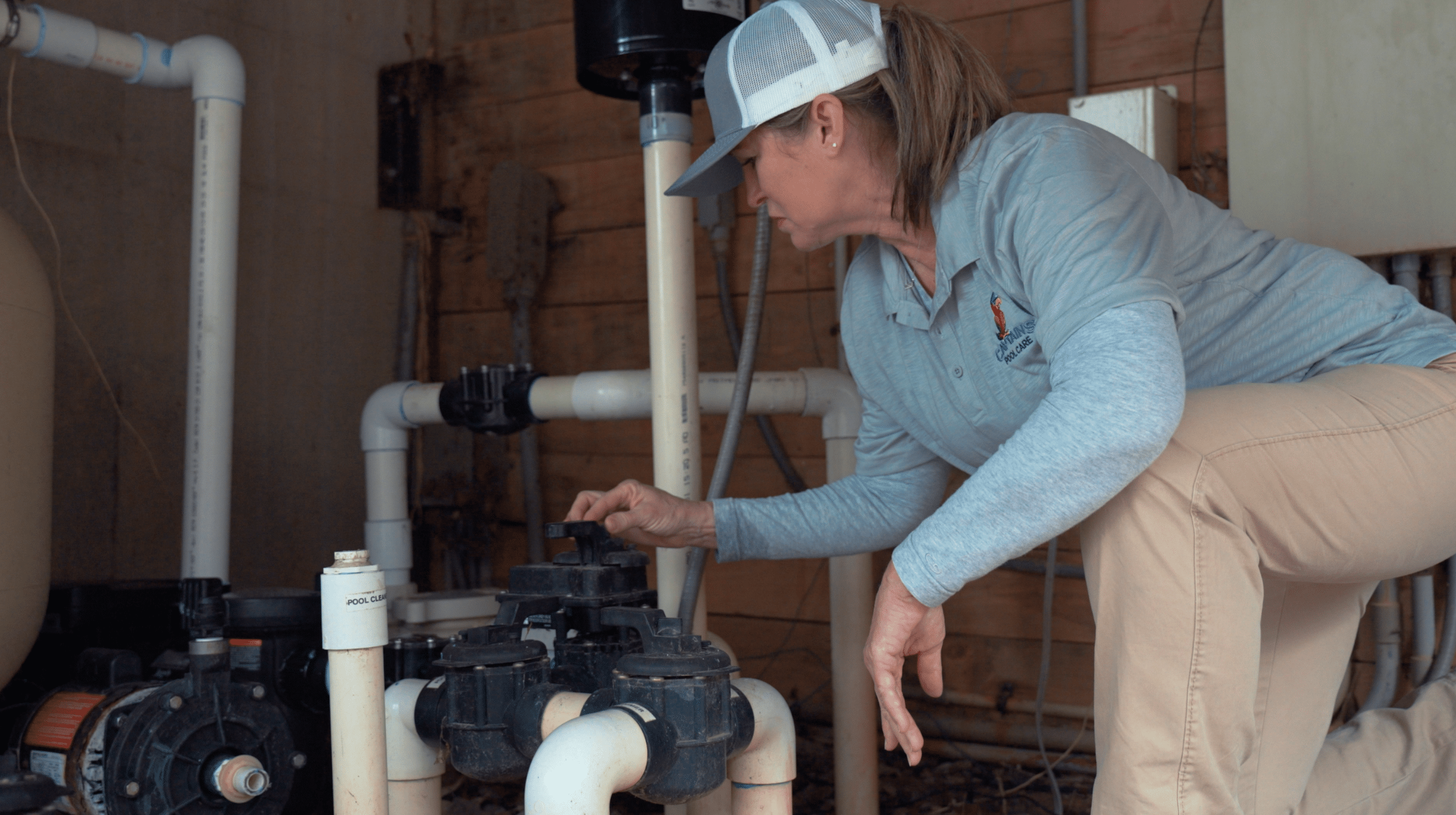 pool technician examining a water pump